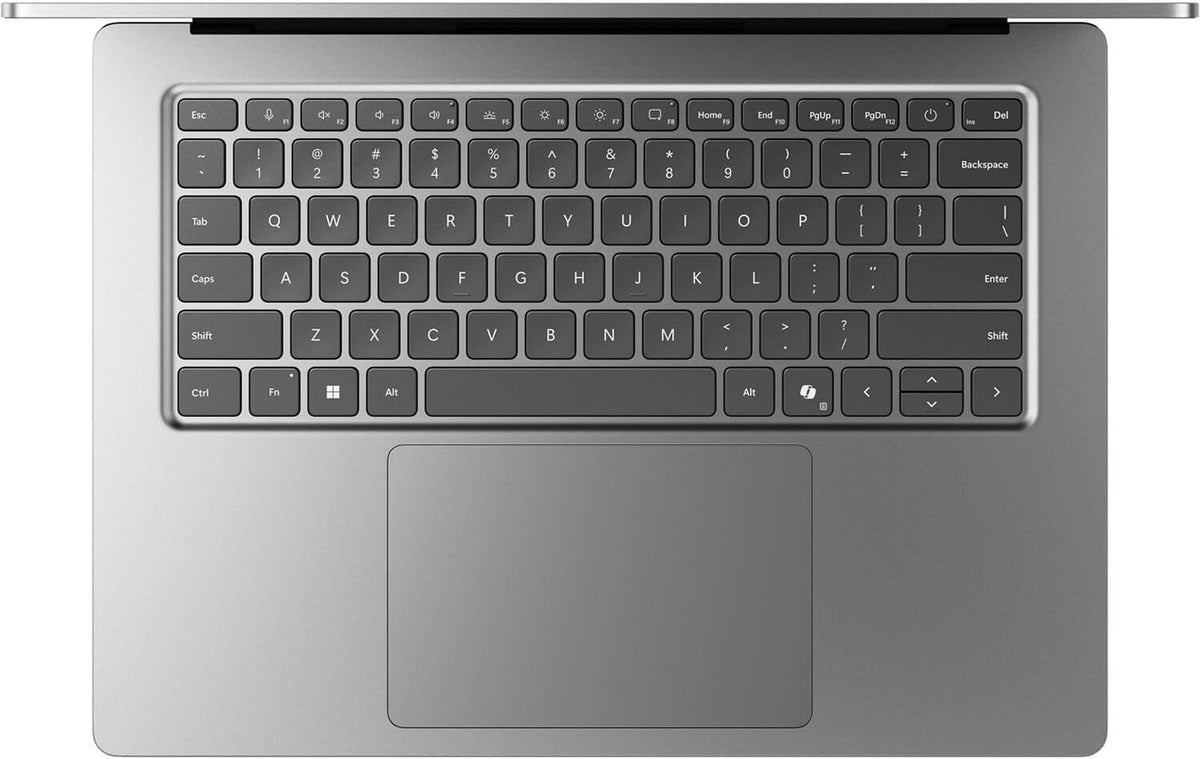 A close-up top-down view of a laptop keyboard and trackpad on a clean white background.